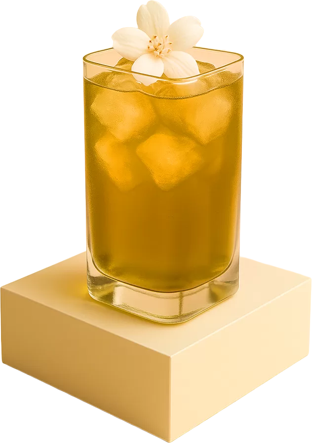A rectangular glass of iced jasmine green tea topped with a white jasmine flower, placed on a beige podium against a warm background.